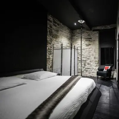 Un ou plusieurs lits dans un hébergement de l'établissement Une Parenthèse, gîte de charme et spa.