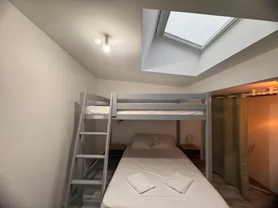 Un ou plusieurs lits dans un hébergement de l'établissement Maison 8 pers -Au bon endroit - 12 min du Parc