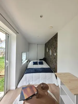 Un ou plusieurs lits dans un hébergement de l'établissement L'Home Had_oro
