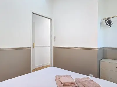 Un ou plusieurs lits dans un hébergement de l'établissement Appartement Le Bd Haussmann, chic & raffiné !