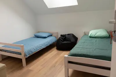 Un ou plusieurs lits dans un hébergement de l'établissement Duplex la galerie