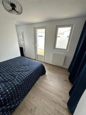 Un ou plusieurs lits dans un hébergement de l'établissement Maison proche de la mer