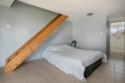 Un ou plusieurs lits dans un hébergement de l'établissement Maison au calme à 400m de la plage
