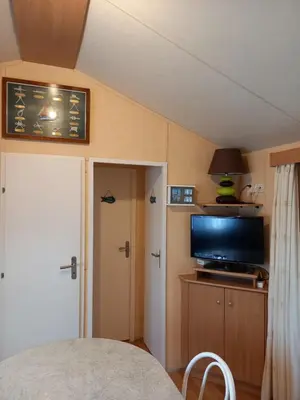 Cuisine ou kitchenette dans l'établissement mobil home camping *** les ollivaud