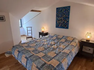 Un ou plusieurs lits dans un hébergement de l'établissement Gîte confortable 2 chambres avec jardin, animaux admis, Wifi, parking - FR-1-622-80