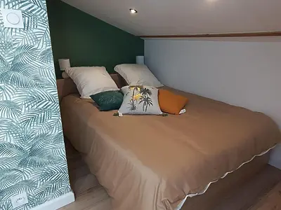 Un ou plusieurs lits dans un hébergement de l'établissement Le petit duplex des barres