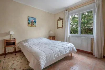 Un ou plusieurs lits dans un hébergement de l'établissement Maison avec jardin pour 6 à St Brévin L’Océan