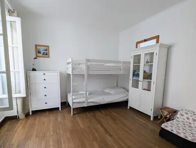 Un ou plusieurs lits dans un hébergement de l'établissement Charmante Maison au centre-ville