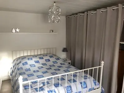 Un ou plusieurs lits dans un hébergement de l'établissement Logement T2 avec terrasse idéal Loire à vélo