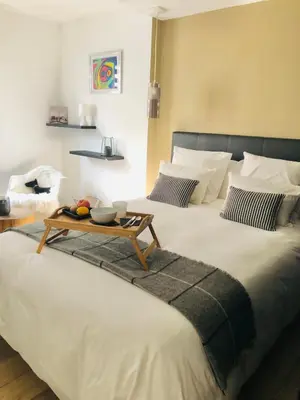 Un ou plusieurs lits dans un hébergement de l'établissement Hygge Loft Nantes Gare TGV jardin des plantes