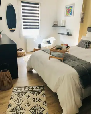 Un ou plusieurs lits dans un hébergement de l'établissement Hygge Loft Nantes Gare TGV jardin des plantes
