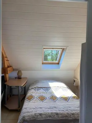 Un ou plusieurs lits dans un hébergement de l'établissement Studio Cosy à la campagne
