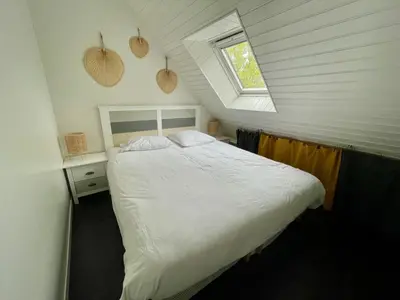Un ou plusieurs lits dans un hébergement de l'établissement Lumineux duplex plage à pied