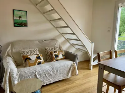 Coin salon dans l'établissement Lumineux duplex plage à pied