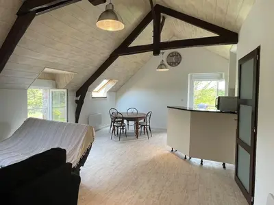 Coin salon dans l'établissement Appartement domaine de Val Léose