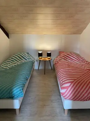 Un ou plusieurs lits dans un hébergement de l'établissement Appartement domaine de Val Léose