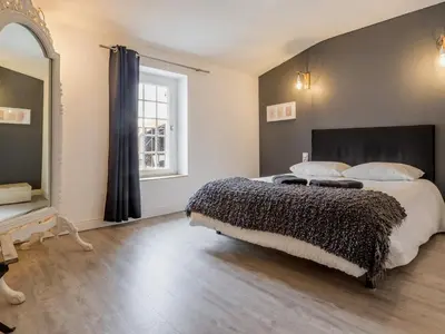 Un ou plusieurs lits dans un hébergement de l'établissement Maison de charme avec jardin près de Nantes, 4 chambres, wifi, équipements bébé et babyfoot - FR-1-306-1272