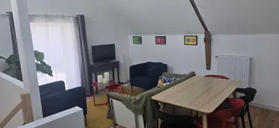 Télévision ou salle de divertissement dans l'établissement Gîte