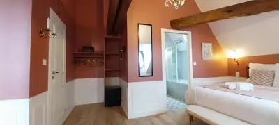 Un ou plusieurs lits dans un hébergement de l'établissement Chambres d'hôtes Le Griffon 1855