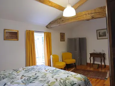 Un ou plusieurs lits dans un hébergement de l'établissement Chambres d'hôtes de la Barbinière