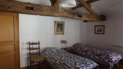 Un ou plusieurs lits dans un hébergement de l'établissement Chambres d'hôtes de la Barbinière