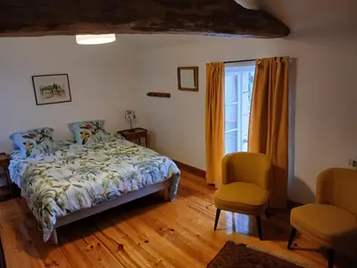 Un ou plusieurs lits dans un hébergement de l'établissement Chambres d'hôtes de la Barbinière