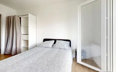 Un ou plusieurs lits dans un hébergement de l'établissement Apartment Nantes Erdre - 3 bedrooms, Parc des Expositions