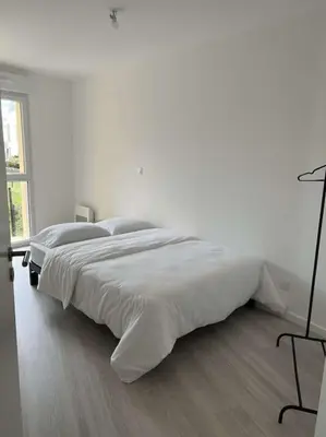 Un ou plusieurs lits dans un hébergement de l'établissement Appartement proche gare et centre-ville