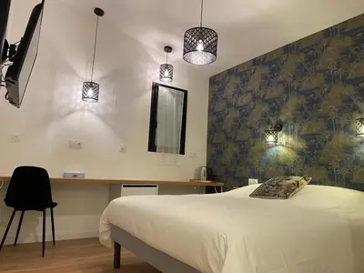 Un ou plusieurs lits dans un hébergement de l'établissement La Maison Blanche