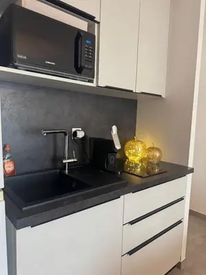 Cuisine ou kitchenette dans l'établissement La Lumière du Coeur