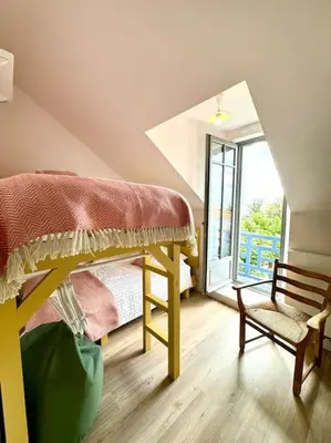 Un ou plusieurs lits dans un hébergement de l'établissement Face Mer Villa Le Ker Breton
