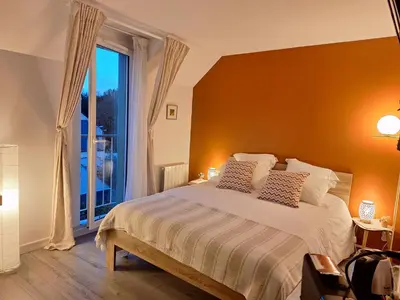 Un ou plusieurs lits dans un hébergement de l'établissement Saint Jo Verte, chambre d' hôte Quartier Beaujoire Parc des expositions Parc Floral
