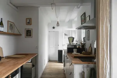 Cuisine ou kitchenette dans l'établissement Maison d'hôtes La bien-Aimée