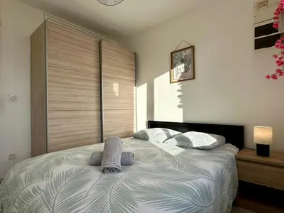 Un ou plusieurs lits dans un hébergement de l'établissement LE MILO - Appartement Cosy en Centre Ville