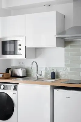 Cuisine ou kitchenette dans l'établissement Le Duplex