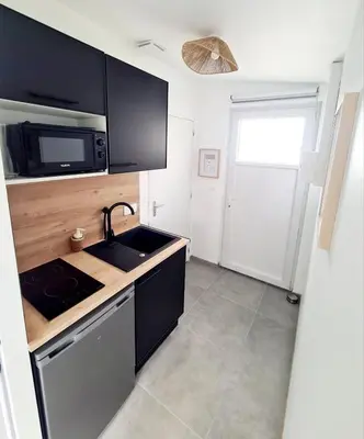 Cuisine ou kitchenette dans l'établissement Le Nid Chalonnais