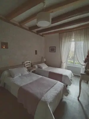 Un ou plusieurs lits dans un hébergement de l'établissement La Petite Boire - Chambres d'hôtes près d'Angers