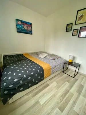 Un ou plusieurs lits dans un hébergement de l'établissement Bel appartement Nantes