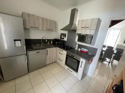 Cuisine ou kitchenette dans l'établissement Maison Paimboeuf