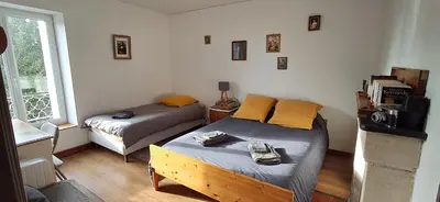 Un ou plusieurs lits dans un hébergement de l'établissement Chambres dans maison de caractère