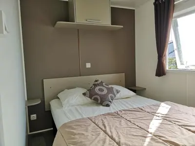 Un ou plusieurs lits dans un hébergement de l'établissement Camping 4 étoiles - Parc aquatique - efciab