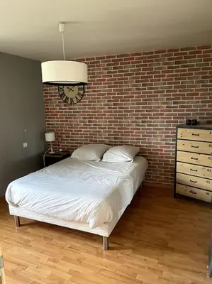 Un ou plusieurs lits dans un hébergement de l'établissement Maison aux volets bleus