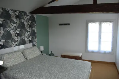 Un ou plusieurs lits dans un hébergement de l'établissement Le Cardoué, chambres d'hôtes proche du Puy duFou