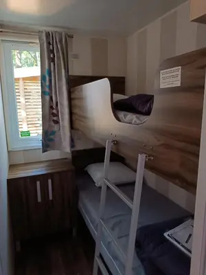 Un ou plusieurs lits dans un hébergement de l'établissement Mobil-home en pleine Nature