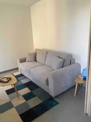 Coin salon dans l'établissement L'appartement des tortues