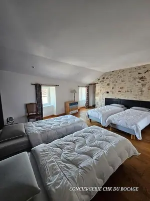 Un ou plusieurs lits dans un hébergement de l'établissement La Belle Vendéenne gîte de charme