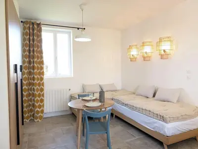 Un ou plusieurs lits dans un hébergement de l'établissement Studio Les Granges