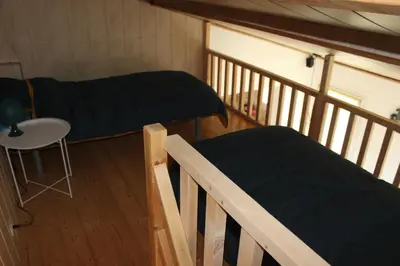Un ou plusieurs lits dans un hébergement de l'établissement Bord de mer