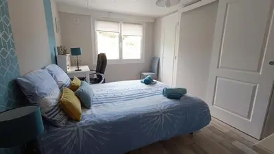 Un ou plusieurs lits dans un hébergement de l'établissement Appartement RdC en bordure de forêt