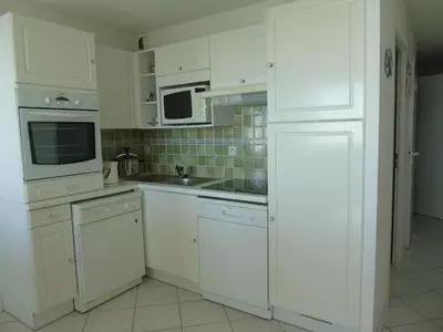 Cuisine ou kitchenette dans l'établissement L'Aloha